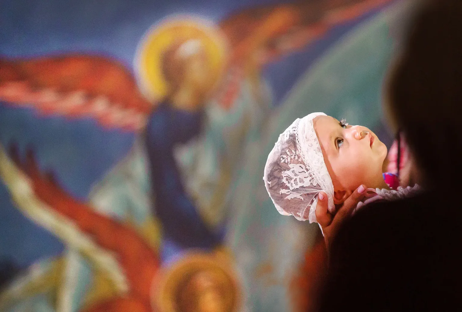 a child with a white cap