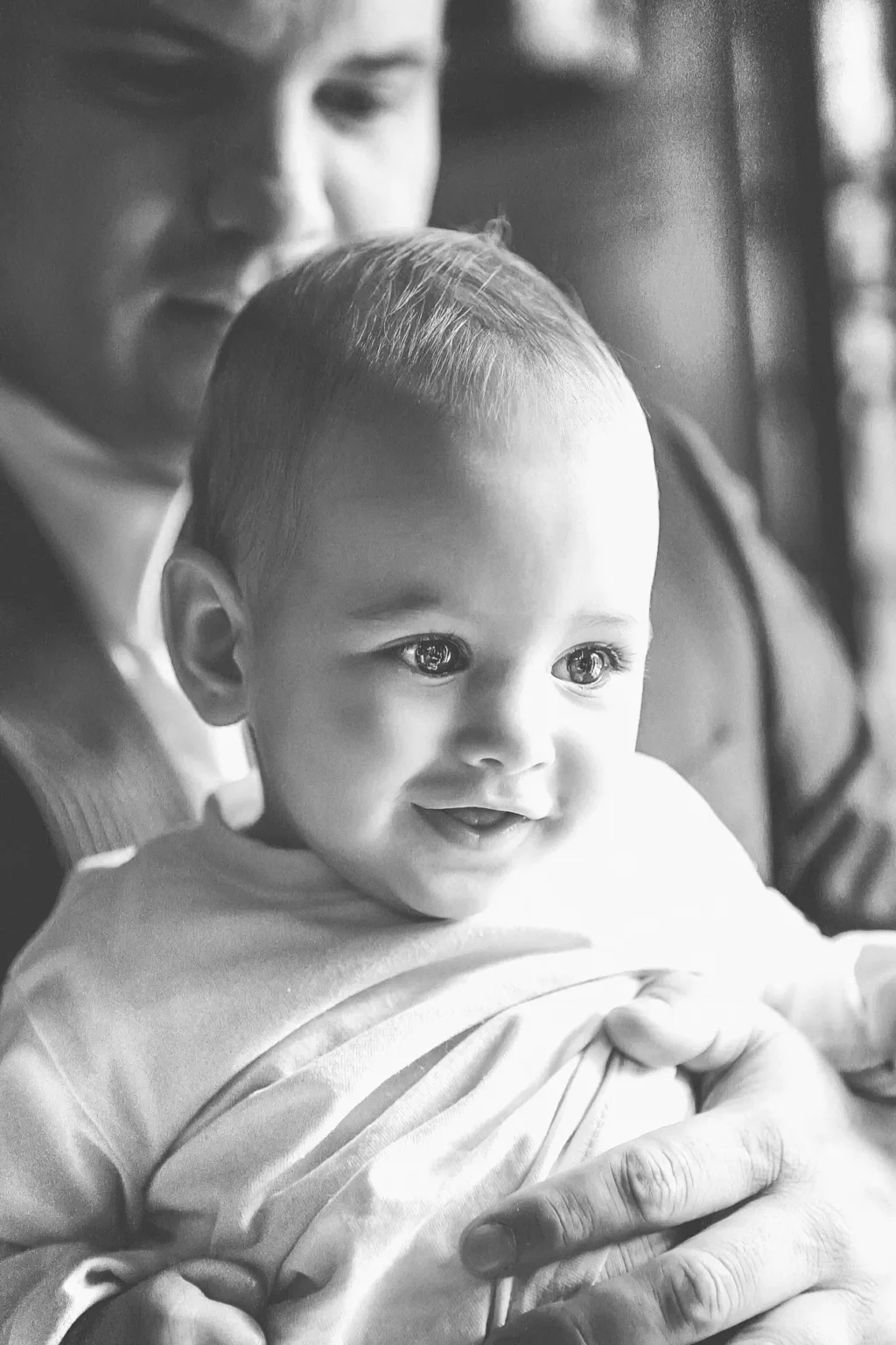 a baby in a man's lap