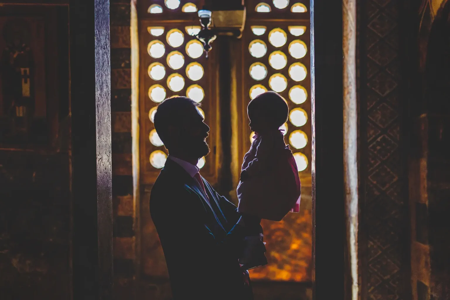 a man holding a baby