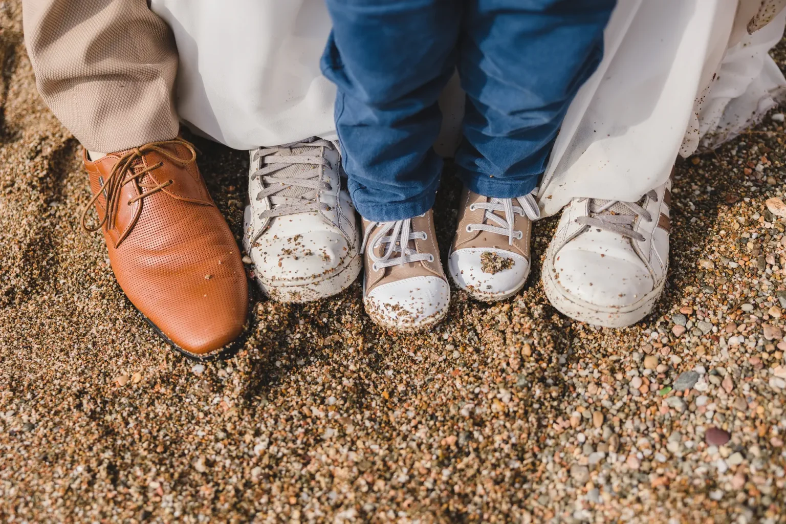a close up of shoes and legs