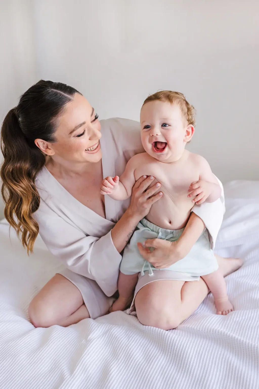 a woman holding a baby