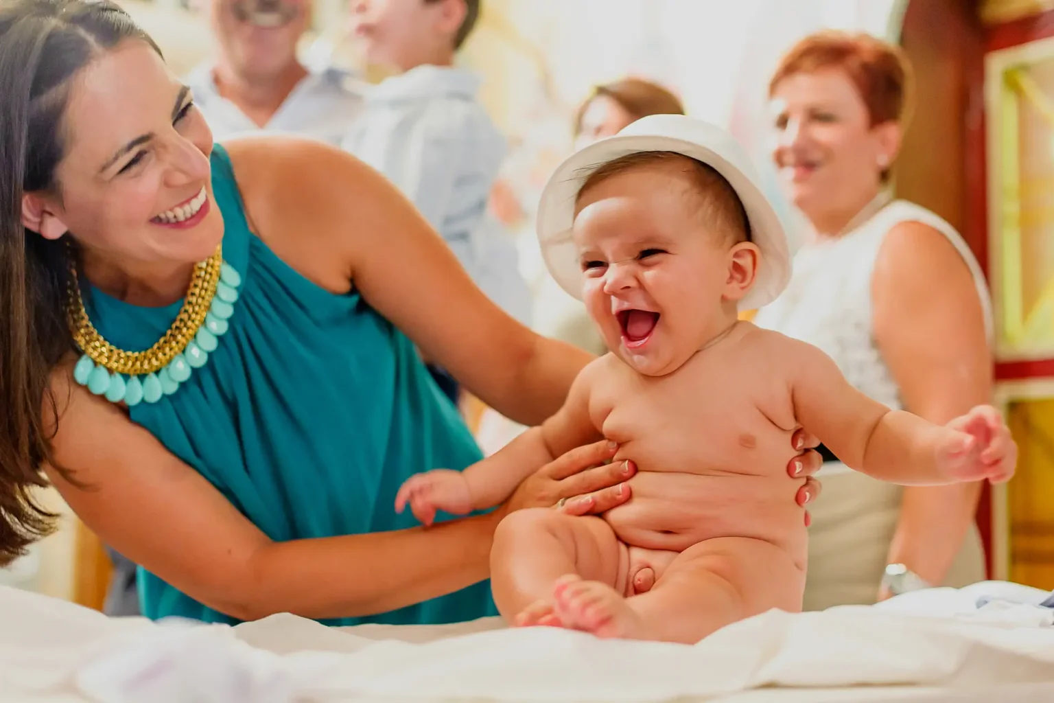 a woman holding a baby