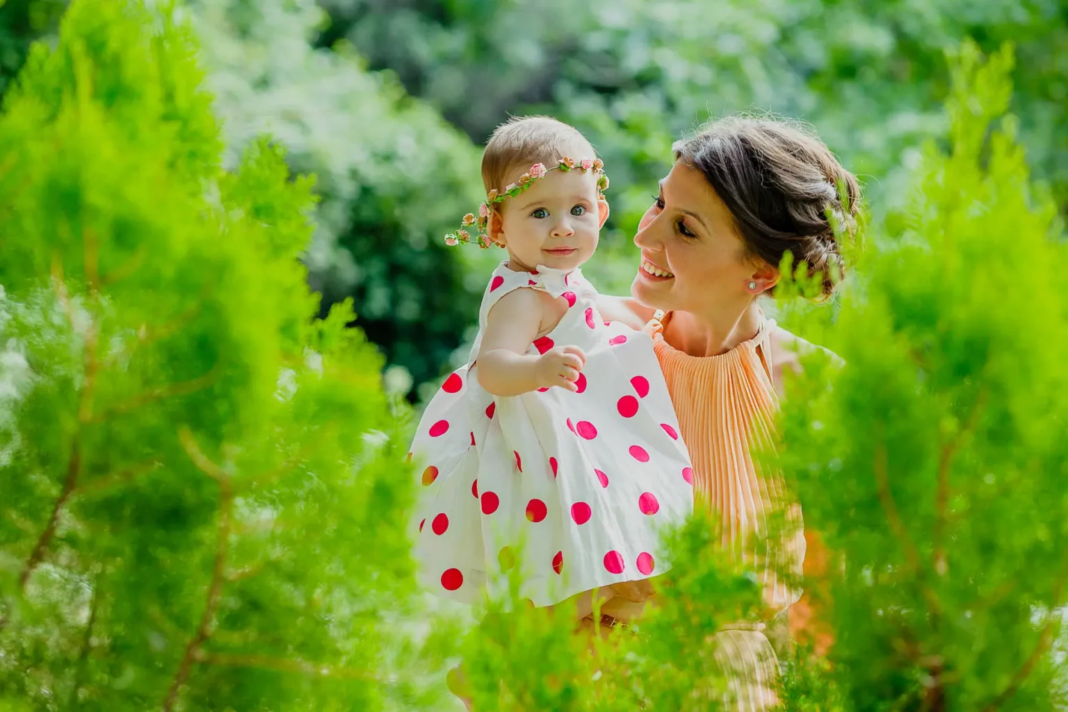 a woman holding a baby