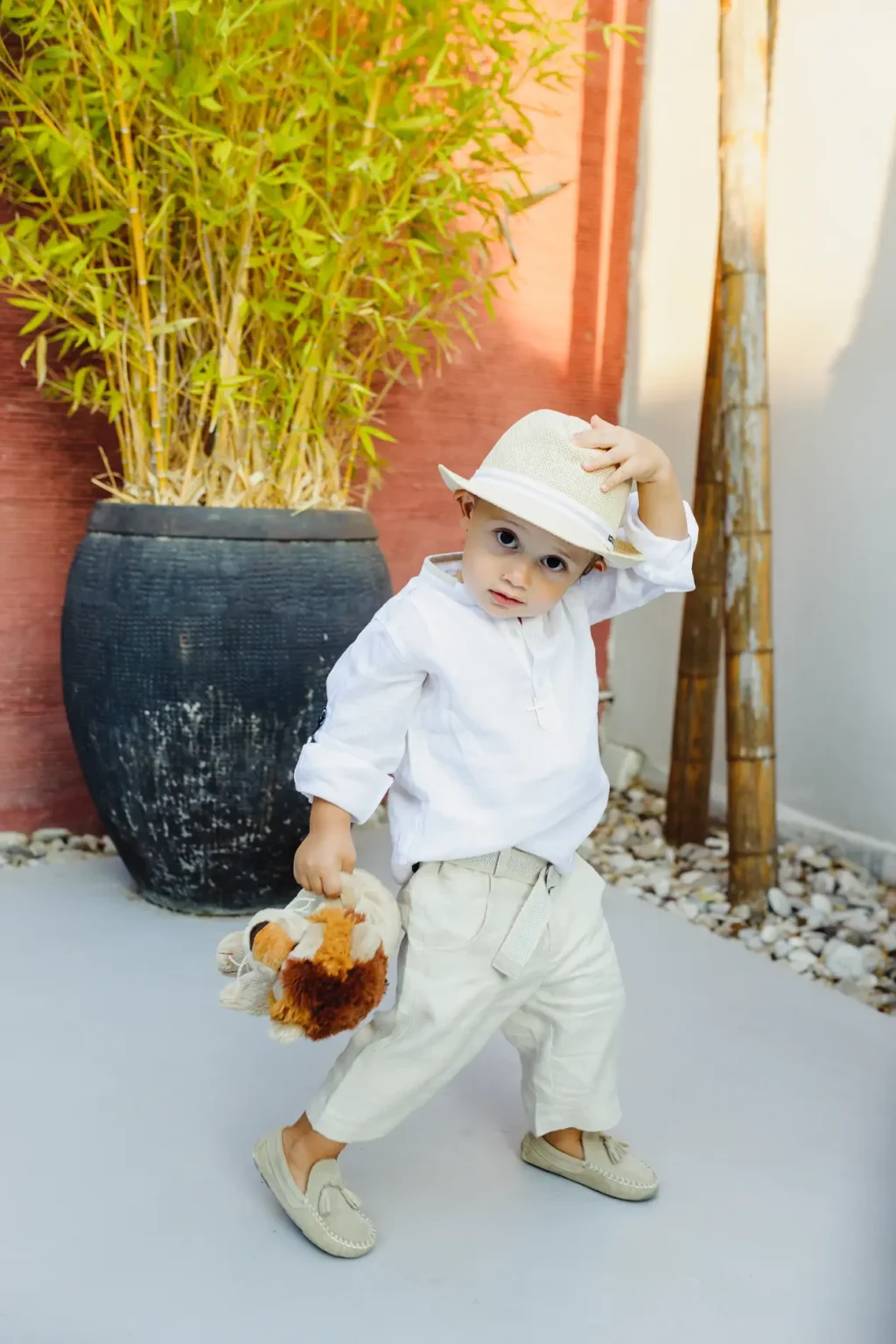 a child holding a stuffed animal