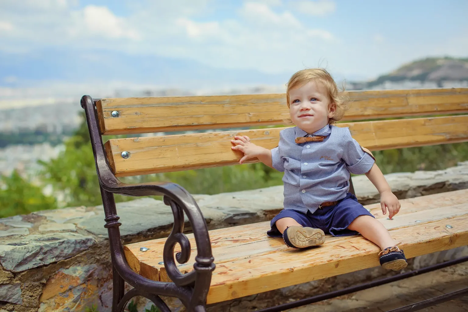 a child sitting on a bench