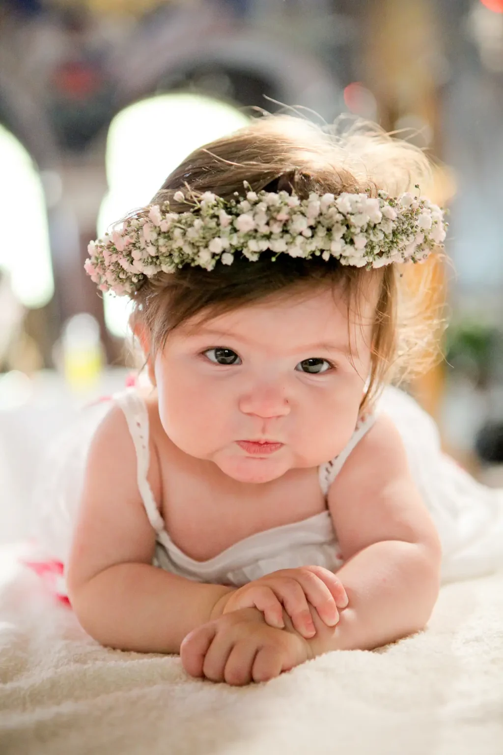 a baby lying on the floor