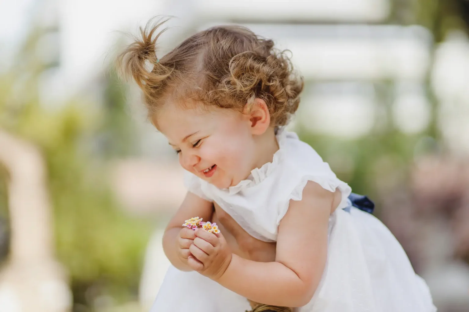 a child holding a small object