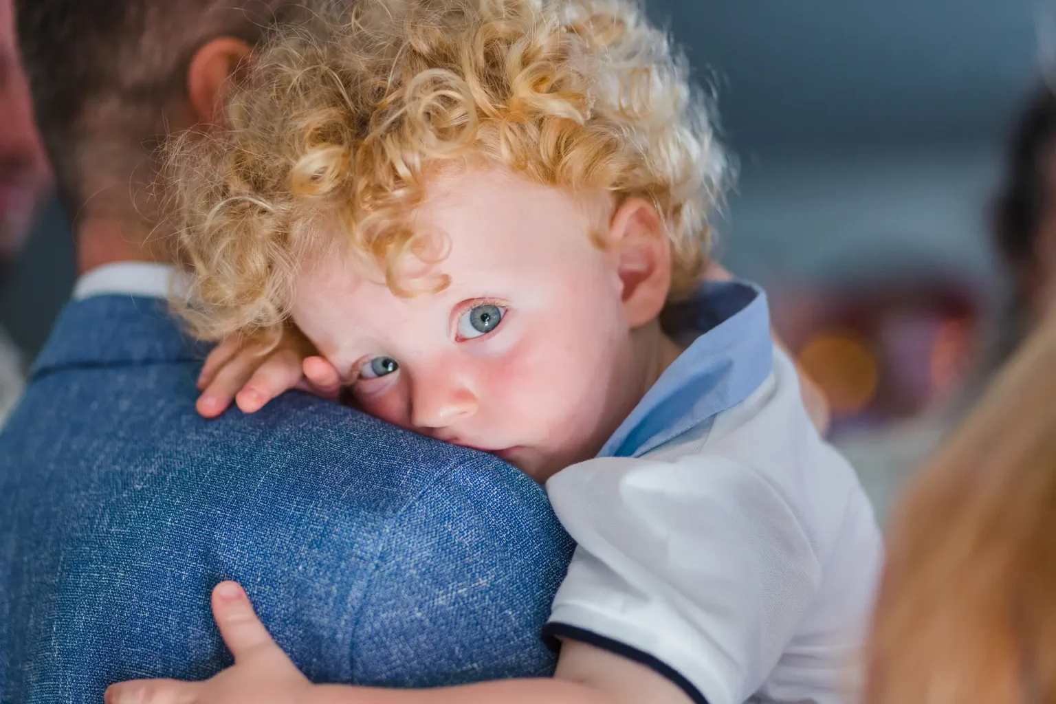 a baby being held by a person
