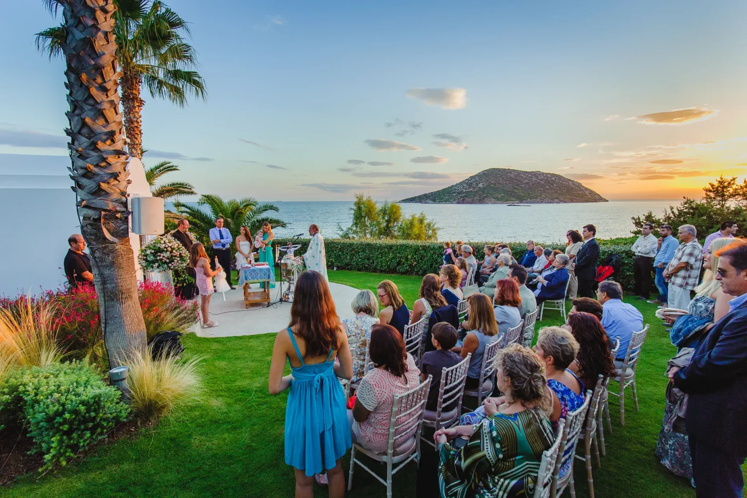 a group of people sitting in chairs outside