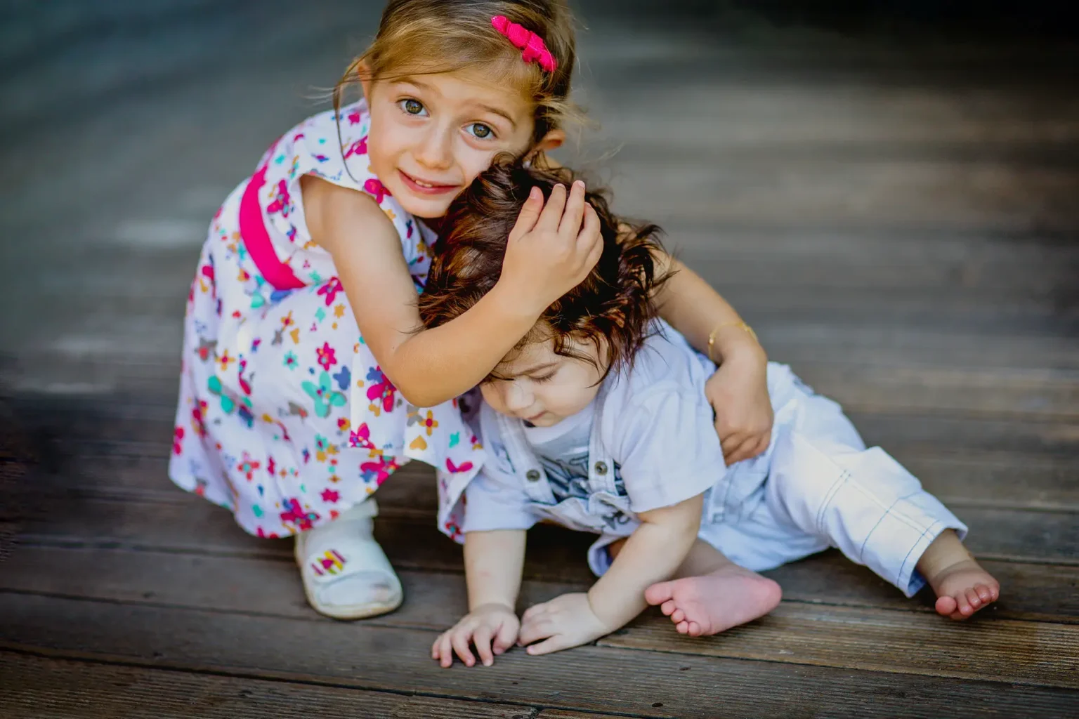 a girl hugging a boy