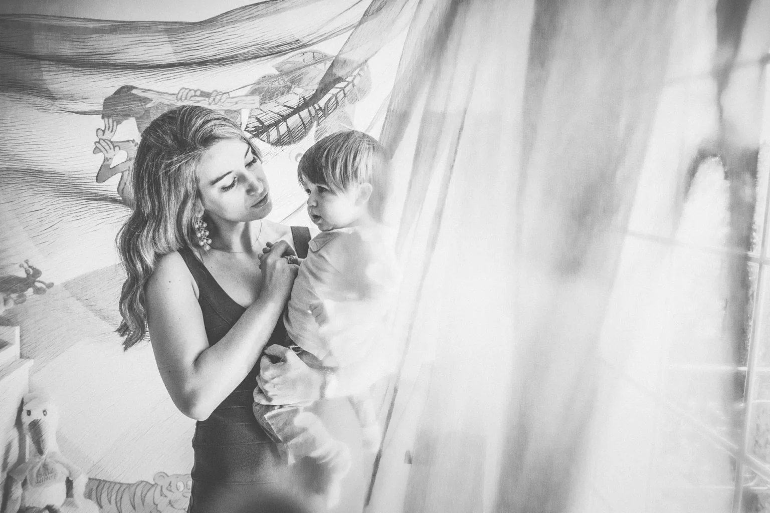 a woman holding a baby