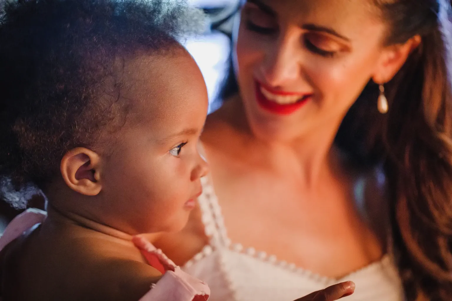a woman holding a baby