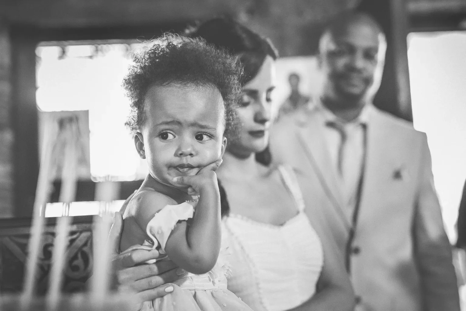 a baby in a white dress