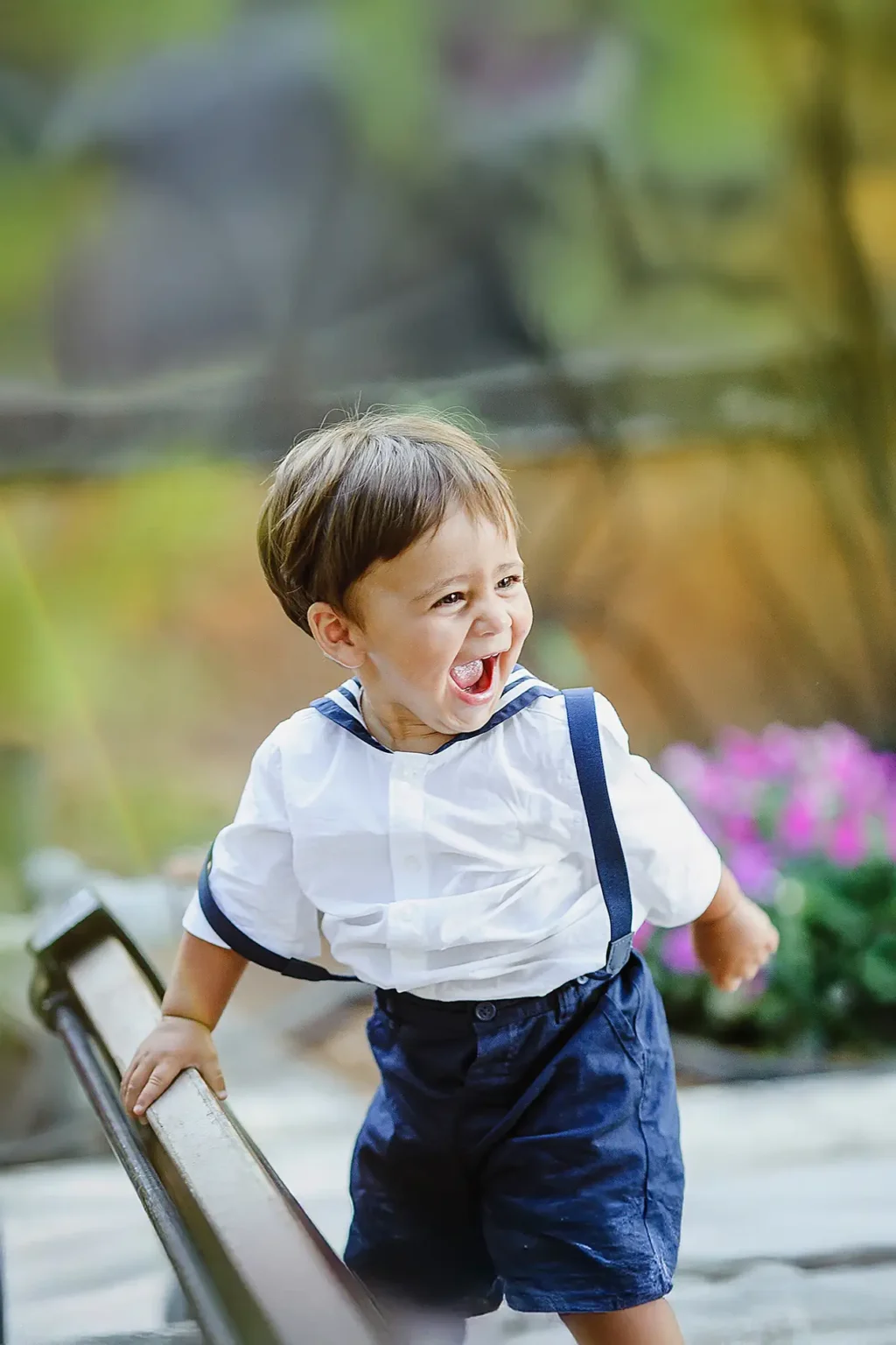 a child standing on a railing