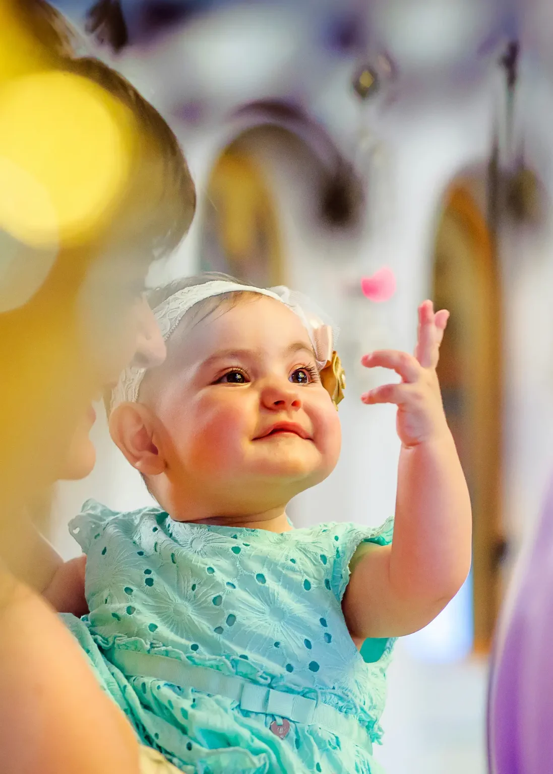 a baby in a blue dress