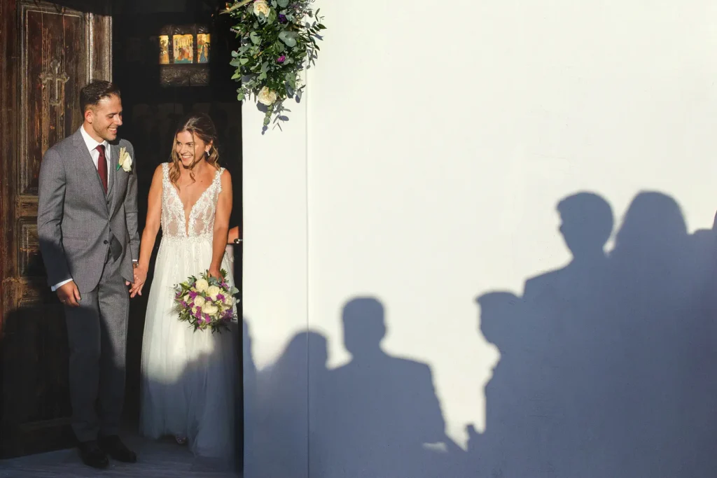 a man and woman in a white dress and suit